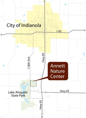 Map showing the location of Annett Nature Center near Hwy 65, south of Indianola, Iowa, and close to Lake Ahquabi State Park; major roads I-92 and Hwy 69 are also marked.