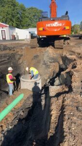 Crews install a sanitary sewer manhole on 4th Street.