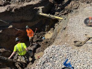 Crews work on underground utilities.